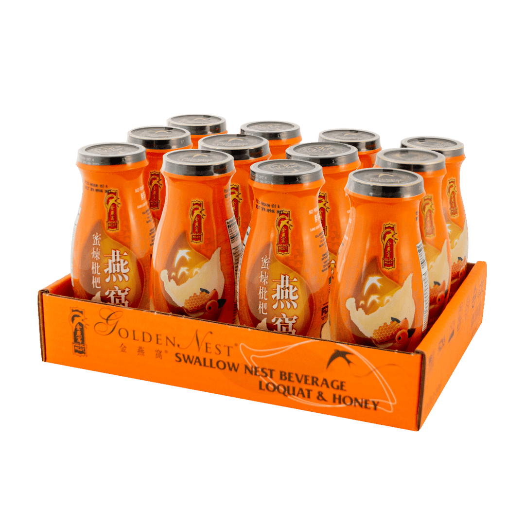 A vibrant orange display box filled with bottles of Golden Nest Swallow Nest Beverage with loquat and honey, showcasing its attractive design.
