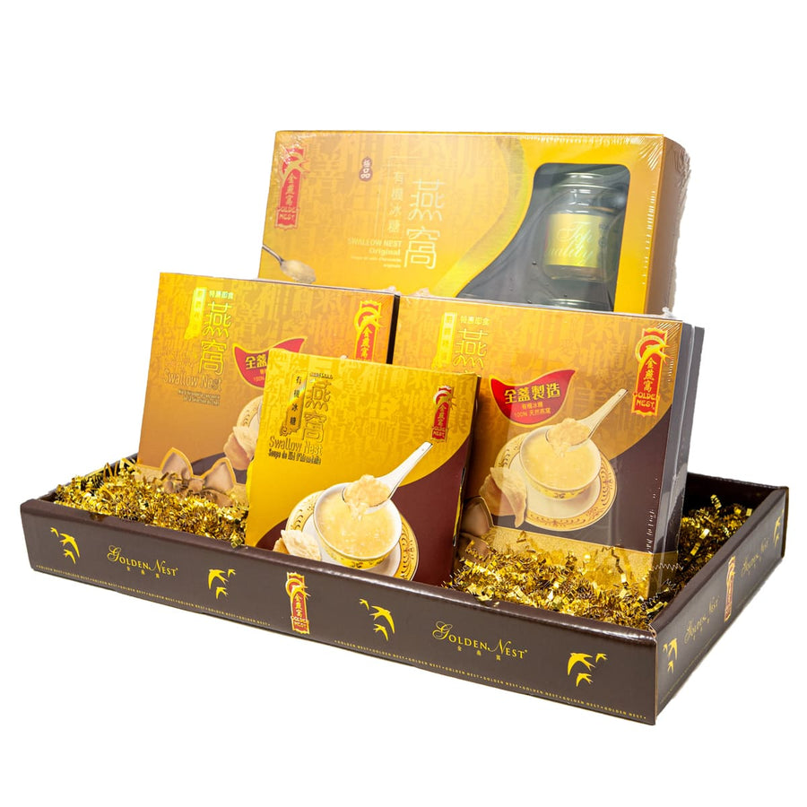 Elegant gift set featuring Golden Nest products: jars and boxes of swallow nest delicacy, adorned with golden accents and packaging.